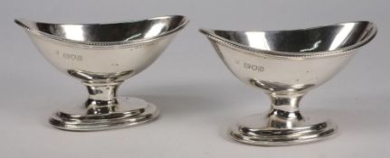 A pair of George V silver pedestal salts