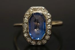 A gold, sapphire and diamond oblong clus