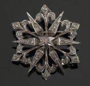 A diamond mounted circular star shaped b