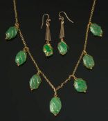 An early 20th century gold and jade frin