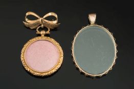 A 9ct gold bow brooch suspending a circu