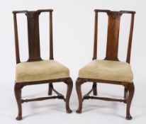 A set of six George I carved walnut dini