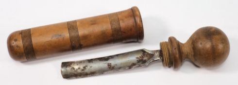 A 19th century shipwright's treen gouge:, the steel blade with turned handle in a cylindrical case,