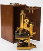 A lacquered brass monocular microscope by R J Beck Ltd, London, number 25624:,