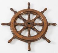 A  small teak ship's helm:, 64cm diameter.