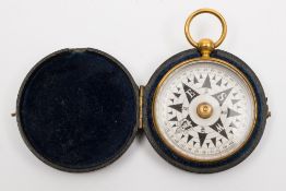 A 19th century gilt brass pocket compass in leather travelling box,