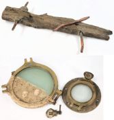 Two  salvaged portholes and a section of ships timber with copper rail:, (3).
