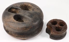 Two ship's deadeyes:, 20cm and 10cm diameter.