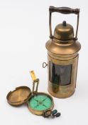 A brass cased 2 1/2 inch dry card prismatic compass by Elliott Brothers  London,