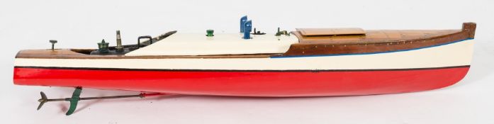 A live steam scale model of a river launch: the ribbed hull with plank and pinned decking enclosing