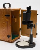 A Russian bM-51-2 binocular microscope:, in a pine case.