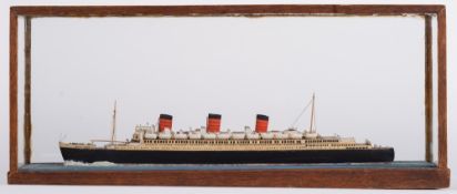 A cased waterline model of The Queen Mary:, with davits and lifeboats to decks, in a glazed case,
