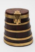 A 19th century mahogany and brass tobacco box in the form of a coopered barrel:,