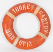 An orange life preserver from the SS Torrey Canyon:, signed as per title to both sides,