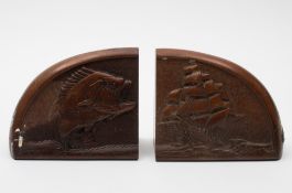 A pair of mid 20th century maritime themed mahogany bookends:, one carved with leaping fish ,