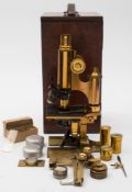 A 20th century lacquered brass microscope by Ross of London:,