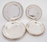 A collection of twelve Cunard Steamship Company silver plated dinner and side plates by Elkington,