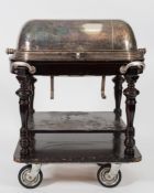 A silver plated carvery trolley: the domed cover enclosing a fitted interior with heated tray and