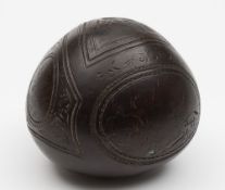 A late 18th/early 19th century carved coconut 'bugbear' flask:,