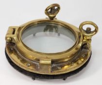 A circular bronze porthole:, stamped '3', 29cm diameter.