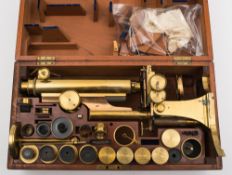 A 19th century lacquered brass binocular microscope by R & J Beck, London: number 4907,