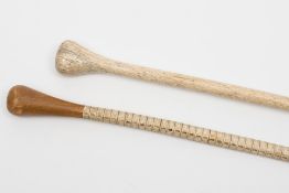 A marine ivory walking cane, together with a fish vertebrae walking cane:,