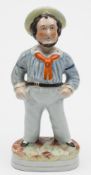 A Staffordshire pottery figure of Jolly Jack Tar: painted in colours on an oval base, 30cm high.