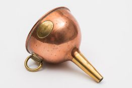 A First Class copper and brass wine funnel from the Holland America Line,