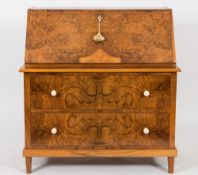 An Art Deco figured walnut bureau:,
