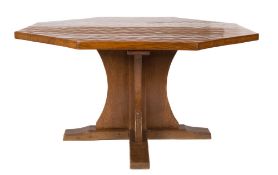By Robert Thompson of Kilburn 'The Mouseman' - An oak octagonal dining table:,