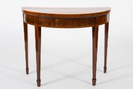 A George III mahogany and inlaid half round card table:, crossbanded in kingwood,
