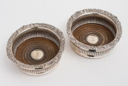 A pair of George IV silver coasters, maker WS possibly William Schofield, London 1823: crested,