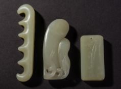 A Chinese celadon jade carved pendant: carved to one side with bamboo shoots, 5.