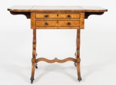 A Regency burr maple veneered and inlaid drop flap work table:, bordered with ebony lines,
