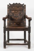 A 17th Century oak and marquetry open armchair:,