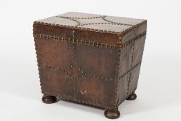 A leather mounted and brass studded coal box:, of rectangular shape with tapered sides,