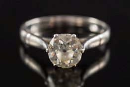 A diamond single stone ring: with round old brilliant cut stones approximately 6.9mm x 4.
