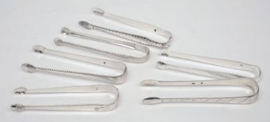 A pair of 19th century silver sugar tongs, maker J*S:  of plain form 13cm.