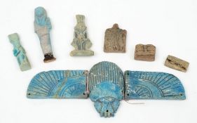 A Egyptian turquoise glazed composition winged Scarab: together with a small ushabti, two amulets,