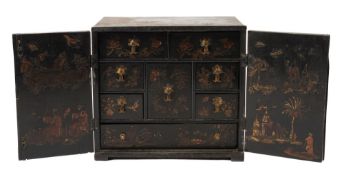 An 18th Century black lacquer and chinoiserie table cabinet:, decorated with figures,