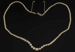 A pearl and seed-pearl single string necklace: with ruby and diamond clasp,