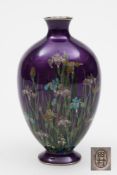 A Japanese cloisonne vase: of ovoid form, decorated with irises, buttercups and grape hyacinth,