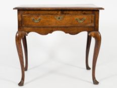 An 18th Century oak rectangular side table:, the top with a moulded edge,