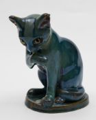 Alphonse Cytère (Rambervillers) a stoneware cat: modelled in seated posture licking one paw,