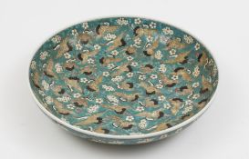 A Chinese 'Hundred Cranes' charger: decorated overall with cranes in flight on a prunus blossom