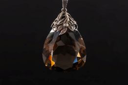 A smoky quartz, pear shaped pendant:. approximately 40mm long x 30mm wide.