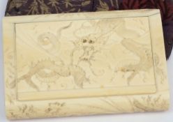 An early 20th century carved ivory cigarette case: of rectangular outline,