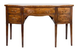 A George III mahogany bow-fronted sideboard:, fitted with a central drawer in the shaped apron,