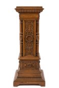 An Edwardian carved oak square pedestal:, the stepped top with a moulded and dentil edge,