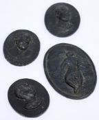 A group of four 18th/19th century black basalt cameo plaques: of oval form depicting neo-classical